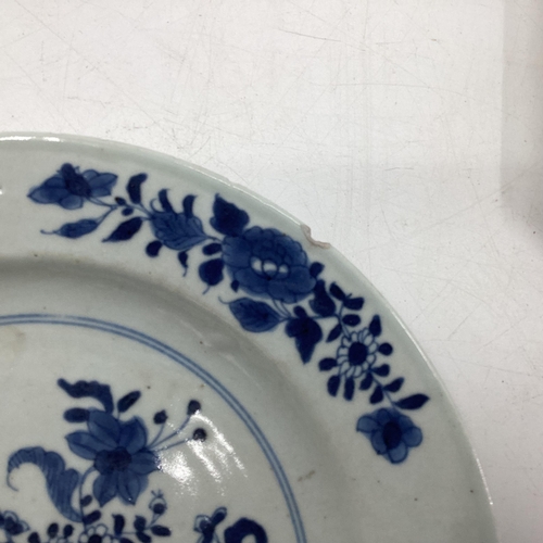 153 - Four Oriental style blue and white plates