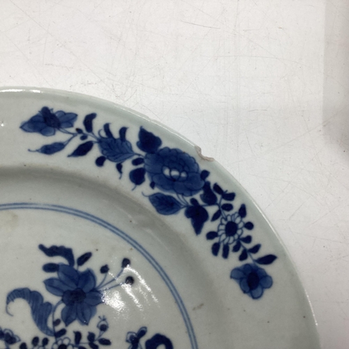 153 - Four Oriental style blue and white plates