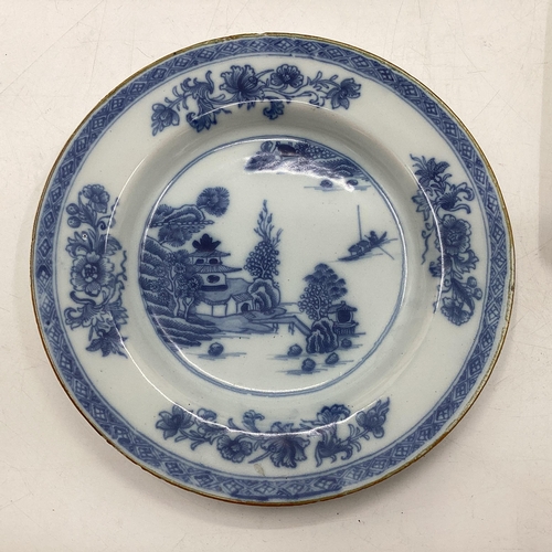 153 - Four Oriental style blue and white plates