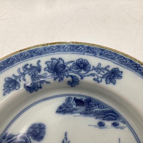 153 - Four Oriental style blue and white plates