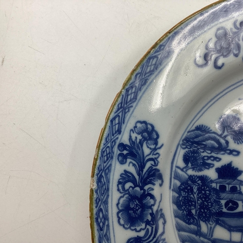 153 - Four Oriental style blue and white plates