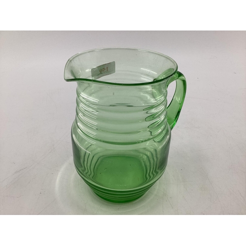 159 - A Collection of moulded glassware to include a ribbon uranium glass lemonade jug and other items