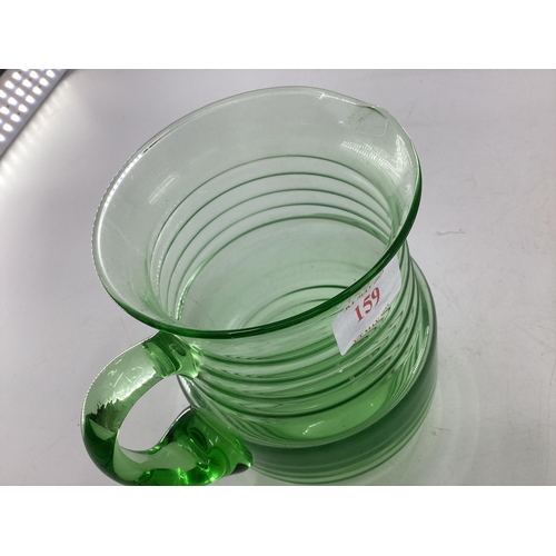 159 - A Collection of moulded glassware to include a ribbon uranium glass lemonade jug and other items