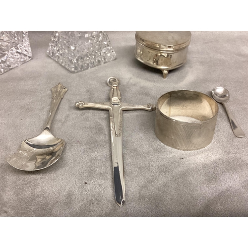 16 - A collection of sterling silver items, to include silver topped dressing table items, heart shaped b... 