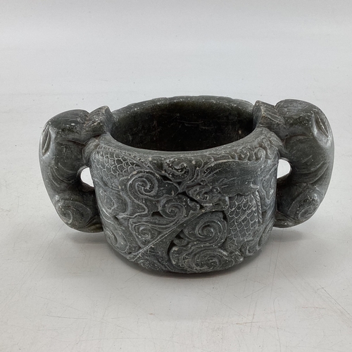 172 - A Scandinavian  soap stone Folk Art mug with twin stylised serpent handles, 7cm x 16cmW