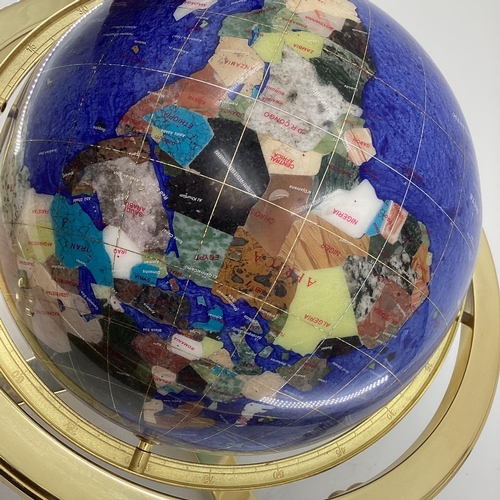 174 - A Lapis style globe mounted with minerals and semi precious stones in gilt wire settings, with compa... 