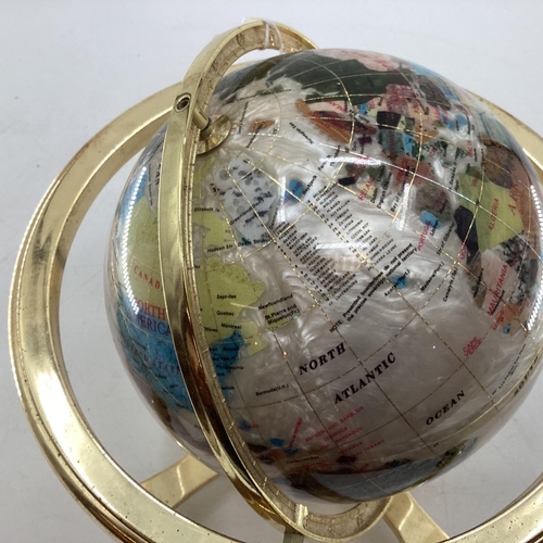 175 - A table top gem set globe in gilt metal mount with compass to base, 27cmH