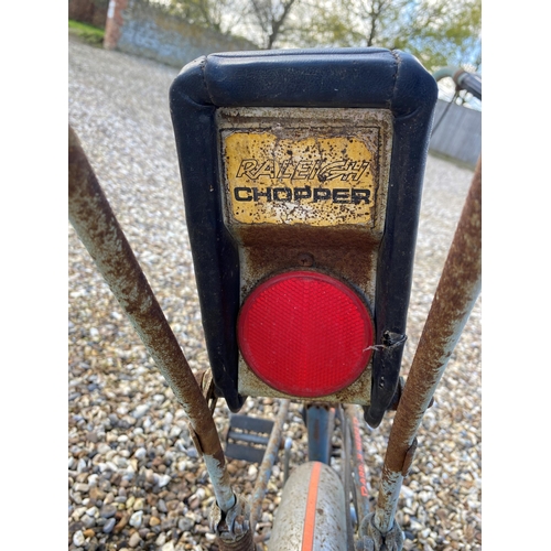 186 - A vintage Raleigh Chopper bike, stamped Arrow Wedge, serial number slightly worn. Bike rusty and in ... 