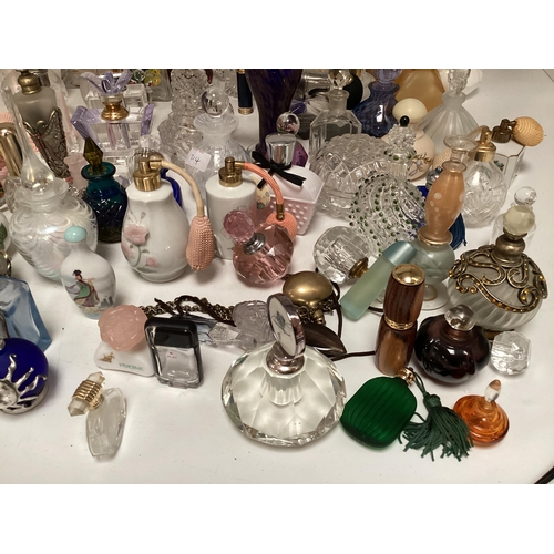 214 - A large collection of perfume bottles mid to late C20th (quantity)