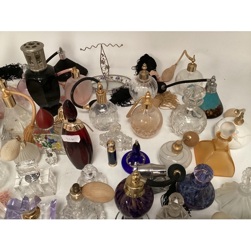 214 - A large collection of perfume bottles mid to late C20th (quantity)