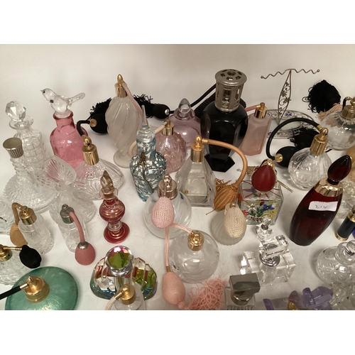 214 - A large collection of perfume bottles mid to late C20th (quantity)