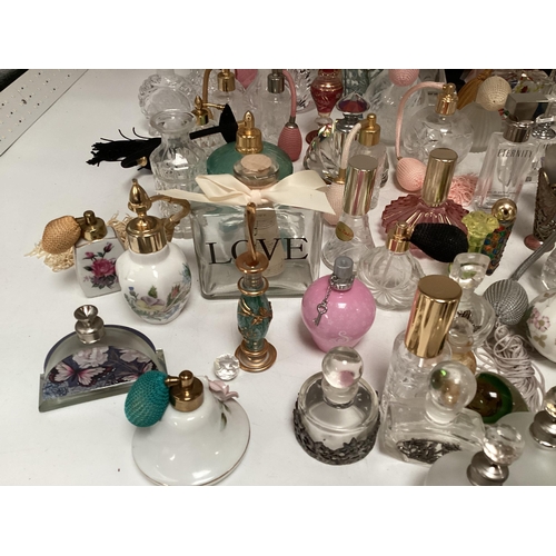 214 - A large collection of perfume bottles mid to late C20th (quantity)