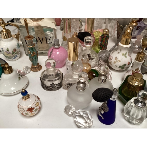 214 - A large collection of perfume bottles mid to late C20th (quantity)