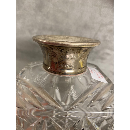 235 - A glass decanter and stopper, with hallmarked silver collar (chip to base of stopper, and frit to ba... 