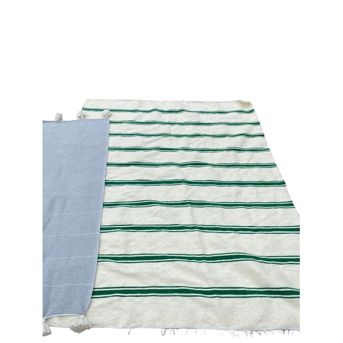 241 - A grey blanket/throw, with white tassels, and a thick Witney style striped blanket, some minor marks