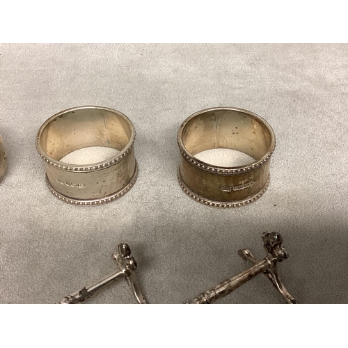 25 - A Collection of sterling silver items to include Napkin ring, knife rests etc,