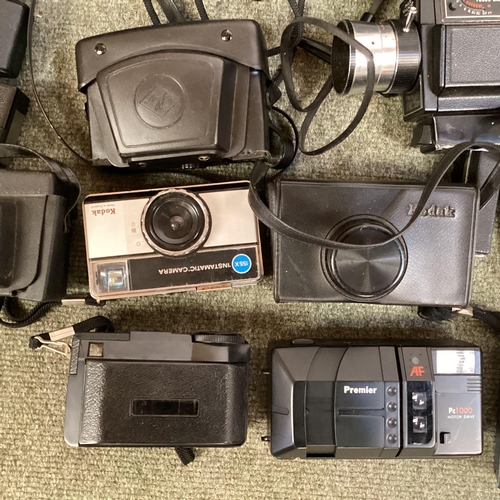 269 - A large collection of C20th cameras, cine and a projector and screen. Quantity.