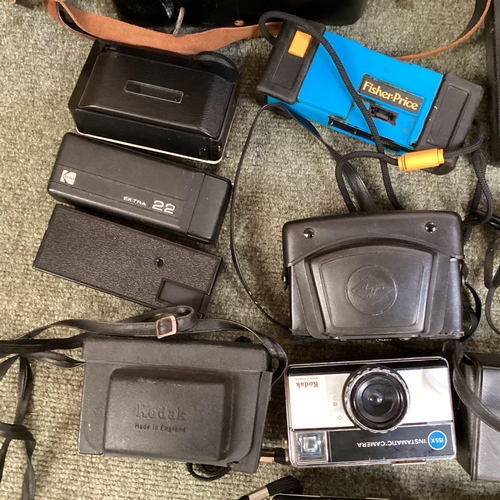 269 - A large collection of C20th cameras, cine and a projector and screen. Quantity.