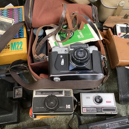 269 - A large collection of C20th cameras, cine and a projector and screen. Quantity.