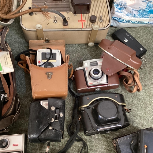 269 - A large collection of C20th cameras, cine and a projector and screen. Quantity.