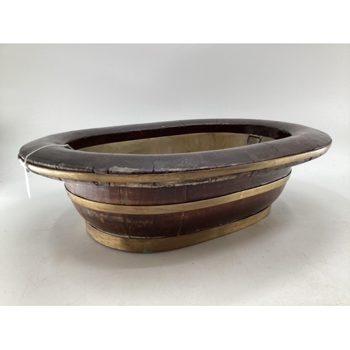 274 - A C19th style Chinese Brass bound elm swallow, baths or basins, one with left out copper insert, 56 ... 