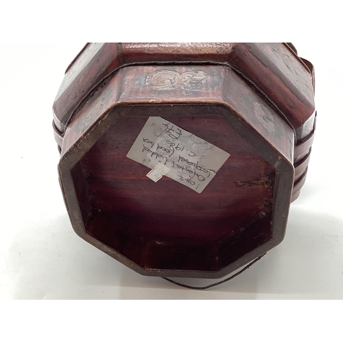 287 - A C19th style Chinese lacquer rice box, of octagonal form with curved handle