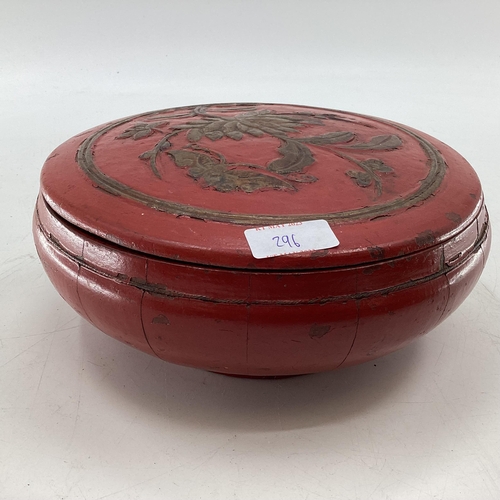 296 - Two Chinese C19th style red lacquer items to include a circular lidded bowl with gilt decoration and... 