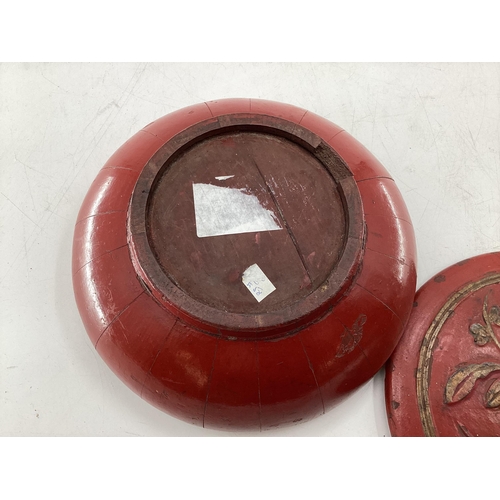 296 - Two Chinese C19th style red lacquer items to include a circular lidded bowl with gilt decoration and... 