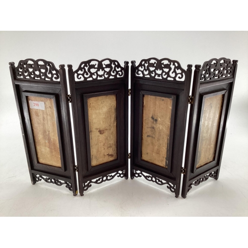 298 - An early C0th four section desk top miniature screen with four ceramic panels to a stylised hardwood... 