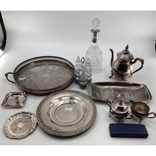 32 - A collection of silver plated wares to include a white metal collared decanter, tray and other items