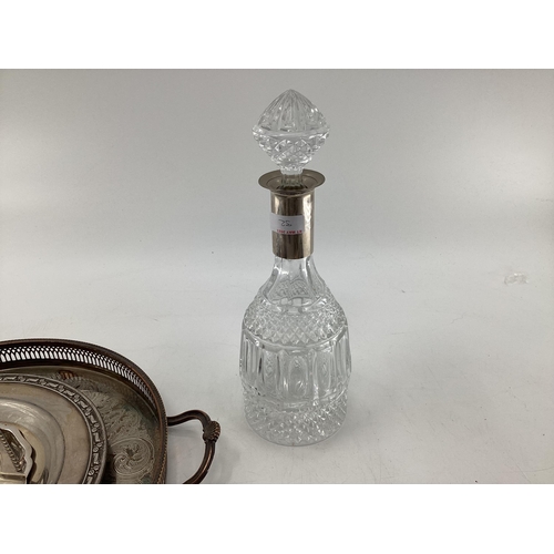 32 - A collection of silver plated wares to include a white metal collared decanter, tray and other items