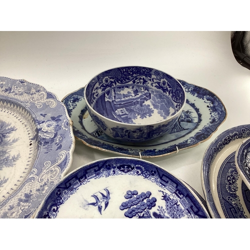 321 - Large collection of blue and white ceramics to include Willow pattern meat plates, bowls etc