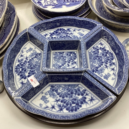 321 - Large collection of blue and white ceramics to include Willow pattern meat plates, bowls etc