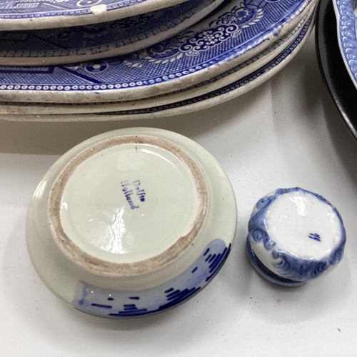 321 - Large collection of blue and white ceramics to include Willow pattern meat plates, bowls etc