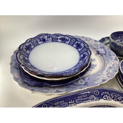 321 - Large collection of blue and white ceramics to include Willow pattern meat plates, bowls etc