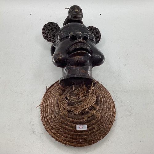 324 - Mid to late C20th West African cast metal item depicting tribal chief topped with mythical creature ... 