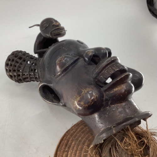 324 - Mid to late C20th West African cast metal item depicting tribal chief topped with mythical creature ... 