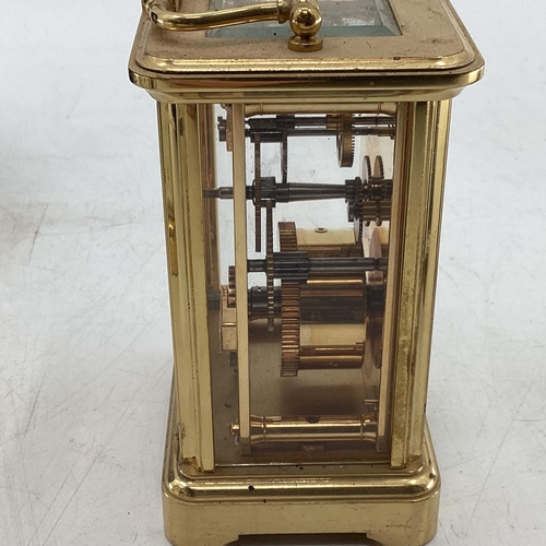 325 - Collection of 4 carriage clocks, and a 1930s 8 day mantle clock with Bakerlight case