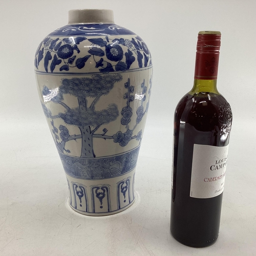 339 - Oriental style blue and white vase of waisted form with square blue character mark to base 33 cm H