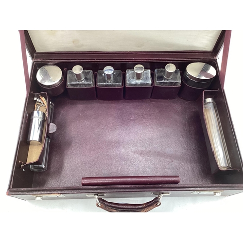 347 - Vintage Burgundy leather travel case with fitted interior and key