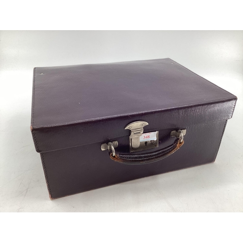 348 - Vintage purple leather travel vanity case with fitted interior containing numerous white metal toppe... 