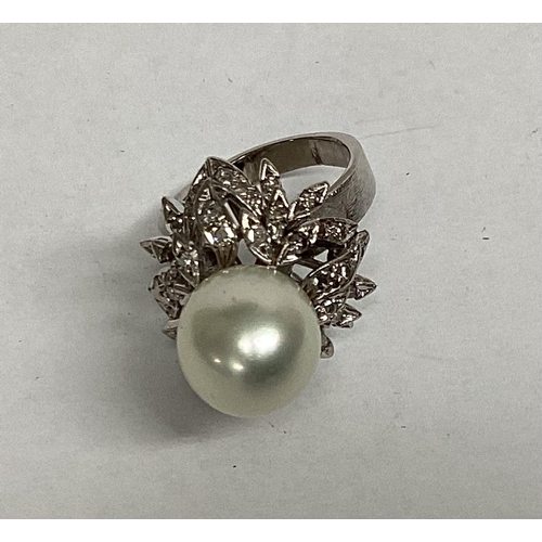 35 - A modern and impressive pearl and diamond ring, size O