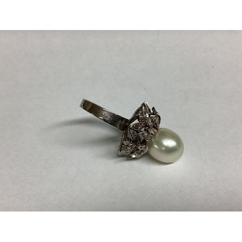 35 - A modern and impressive pearl and diamond ring, size O