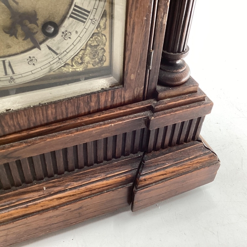 350 - C19th Oak cased mantle clock of large proportions, arched dial with silver chapter ring, gilt spandr... 