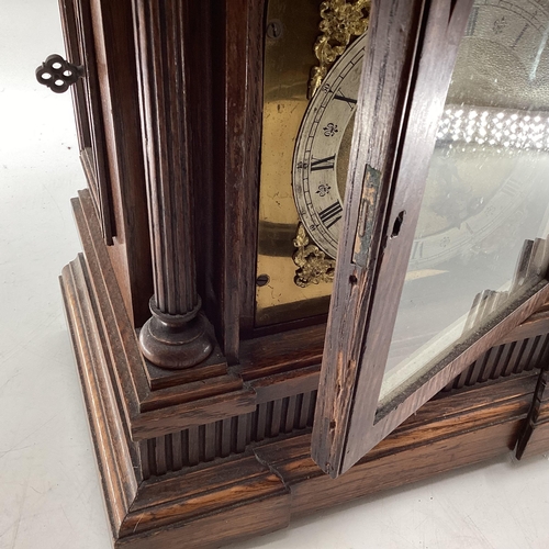 350 - C19th Oak cased mantle clock of large proportions, arched dial with silver chapter ring, gilt spandr... 