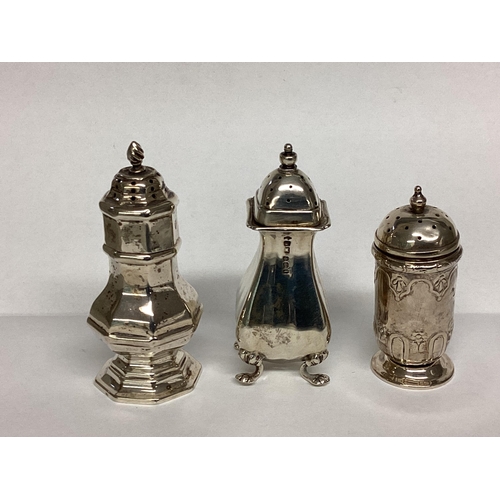 36 - Three Sterling silver pepperettes, together with a silver sovereign case and silver cigarette case, ... 