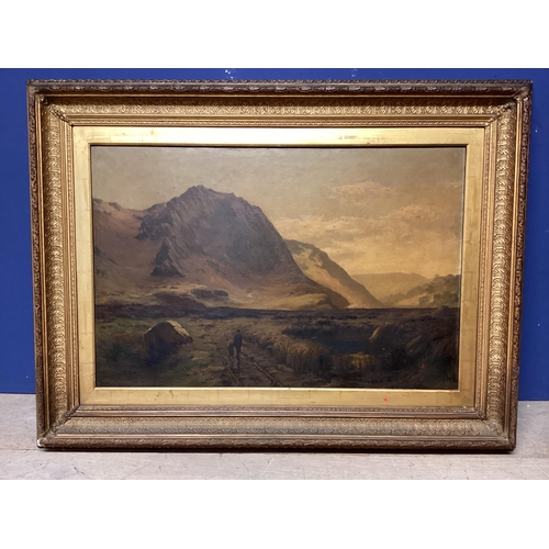 387 - A Scottish School, oil on canvas, two figures walking in a highland scene, in a recessed carved gilt... 