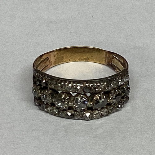 42 - A C19th unmarked yellow metal and diamond ring set throughout with the three lines of an old cut dia... 