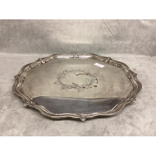 47 - A Victorian Sterling silver circular tray, beaded scalloped edge central floral motif, 35cm diam, on... 