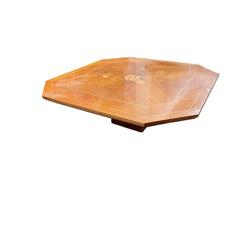 472 - A hexagonal Coffee table on single turned support with Sorento style inlaid top, 130 x 44cm